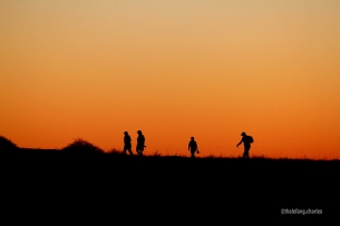 Walkers at sunset